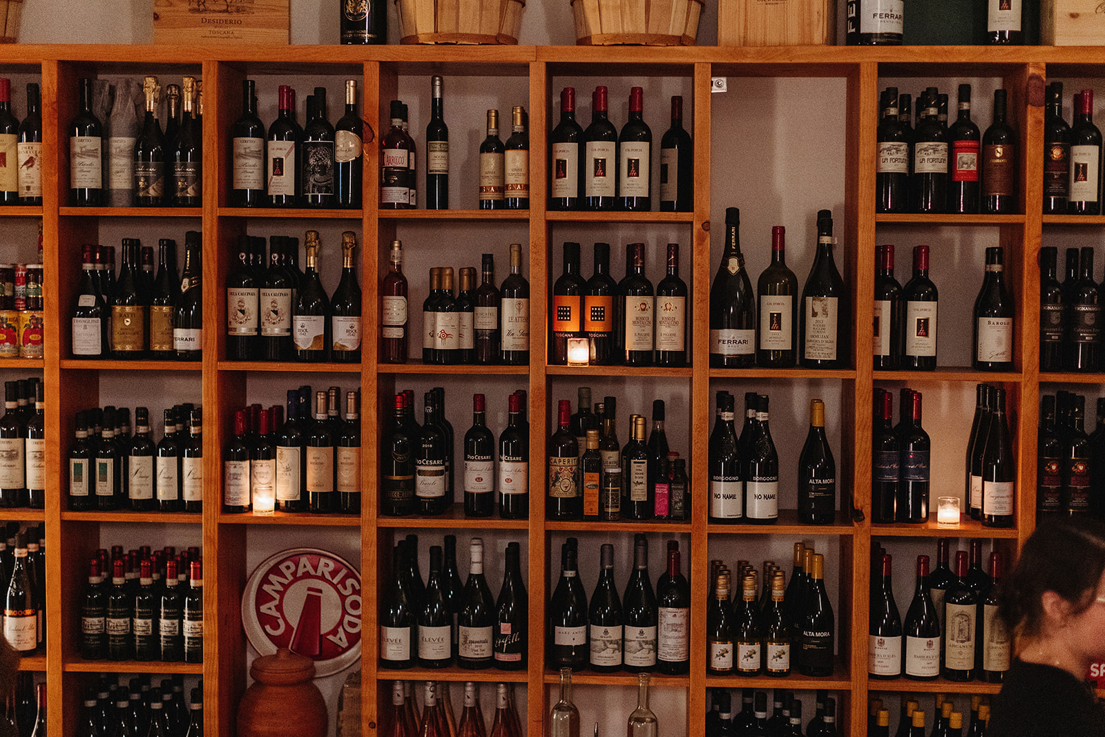 wine bottle wall at allora italian restaurant